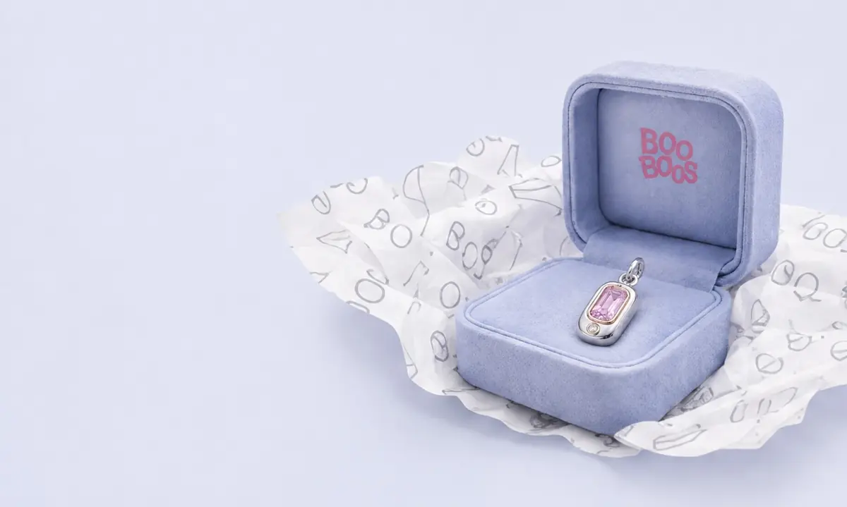 Powder-blue BooBoos keepsake box with a gemstone charm inside